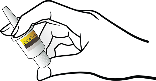 baqsimi traced hand holding bottle